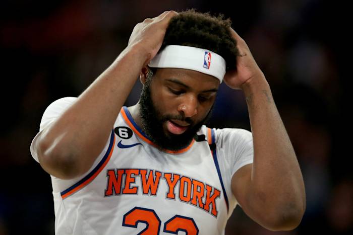 Knicks center Mitchell Robinson puts his hands on his head during Game 1 against Heat